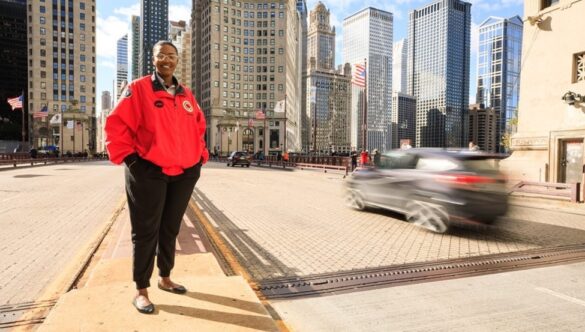 City Year AmeriCorps member on busy city street