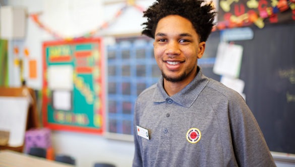 An AmeriCorps member in a classroom.