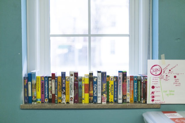 Books on a bookshelf in a City Year school